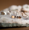 Unique 10k gold disc earrings with salt & pepper diamond. Handmade in Okanagan.